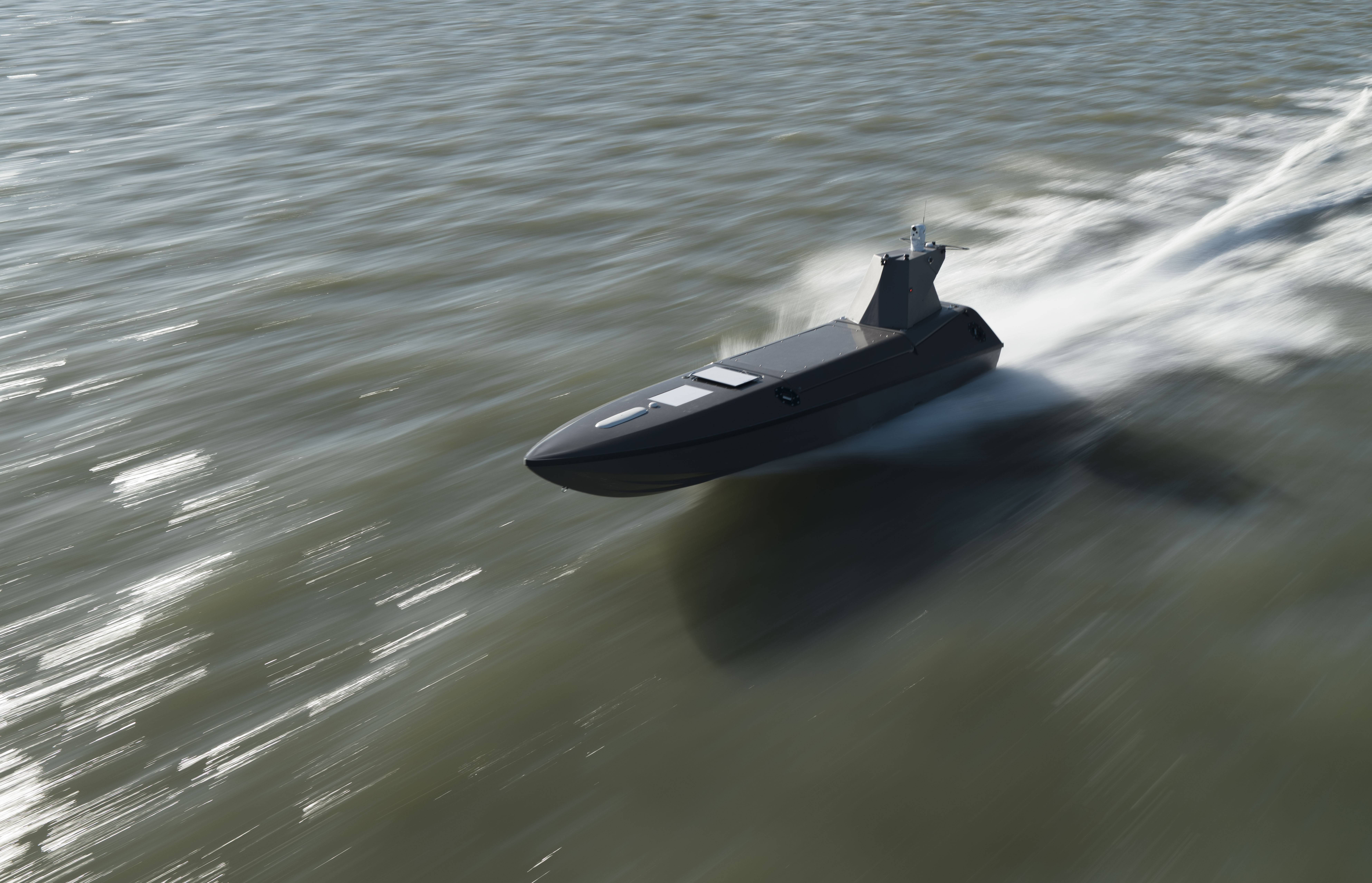 an uncrewed surface vessel designed by Kraken moving at speed