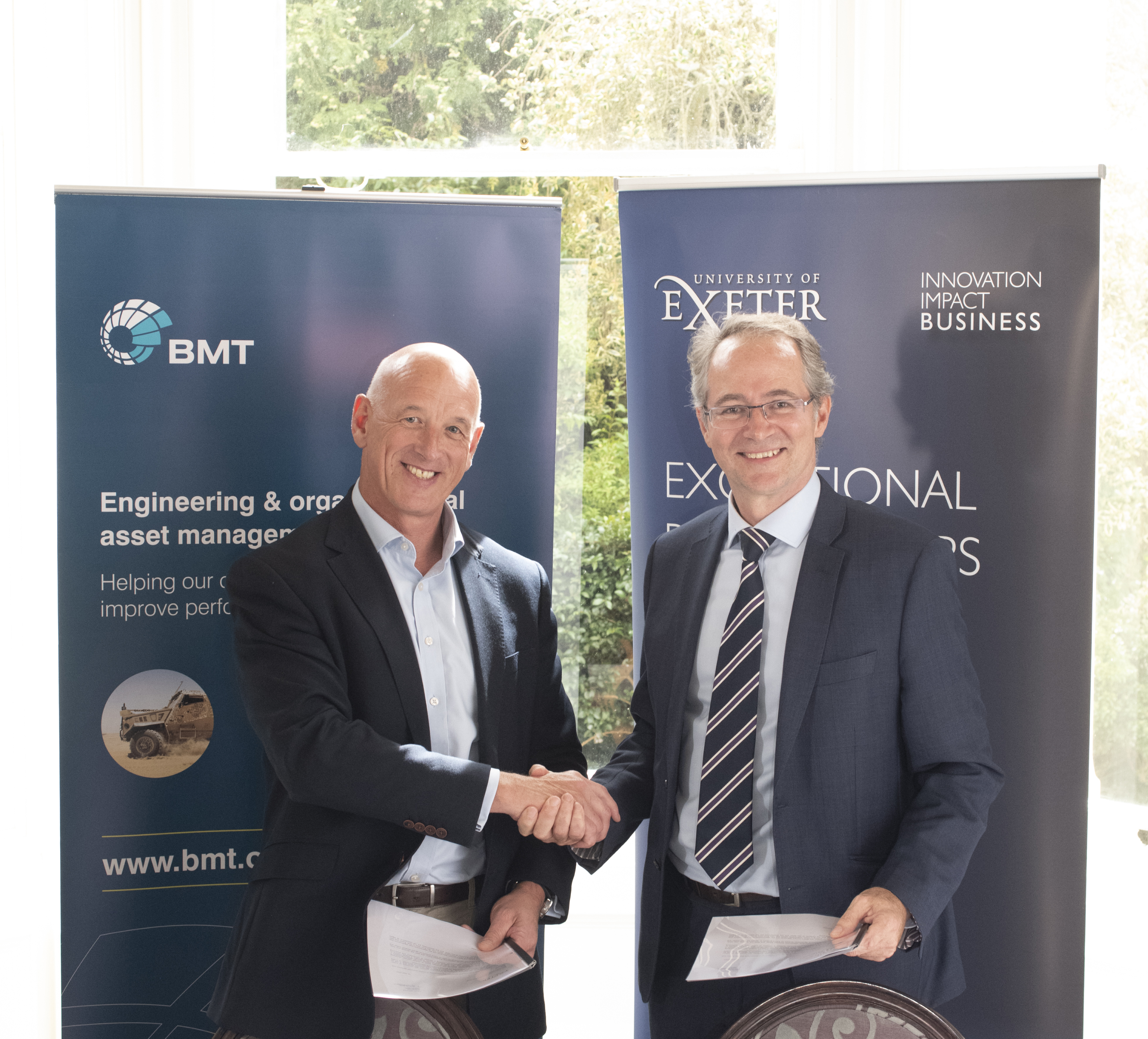 Two men shaking hands - Mark Sullivan, BMT and University of Exeter collaboration