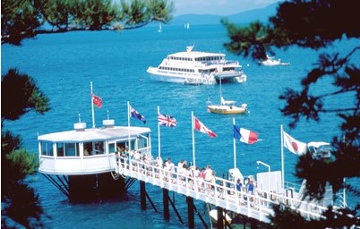 Blue lagoon jetty and moored superyacht