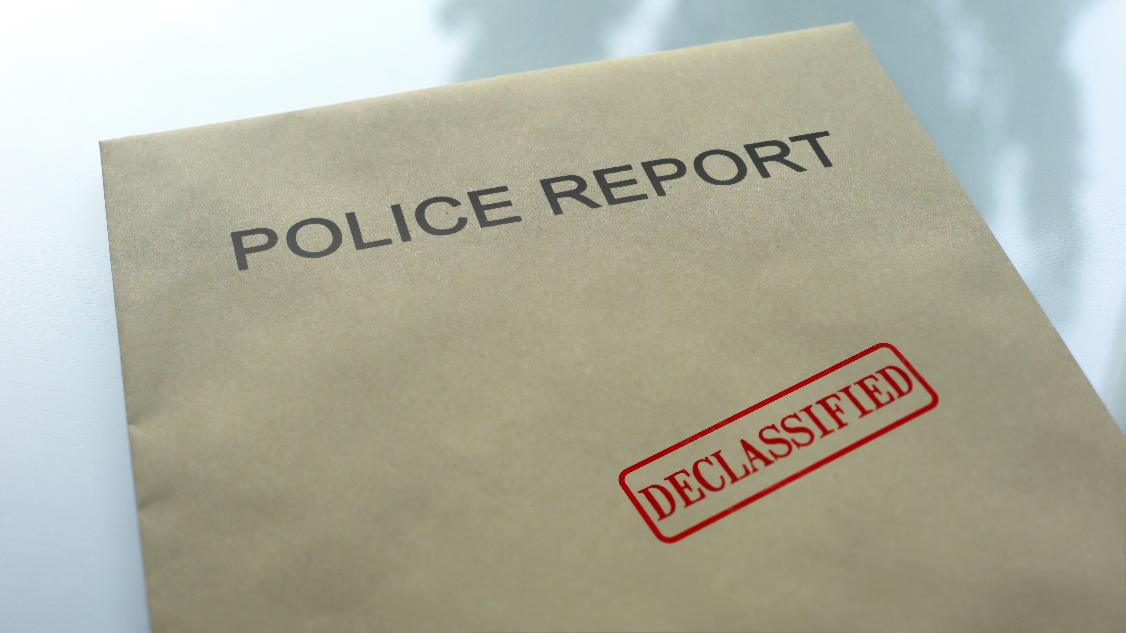 Declassified police report brown envelope